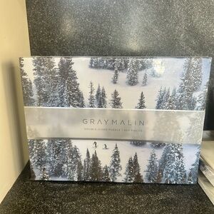 NIB, unopened box . Gray Malin Puzzle — Snowy White and Green Pine Forest